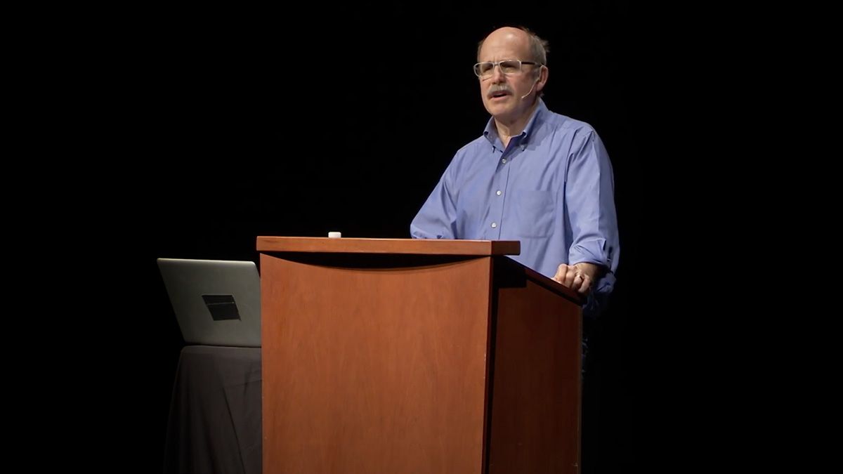 Paul Saffo standing at a podium as he speaks about the Engagement Economy.