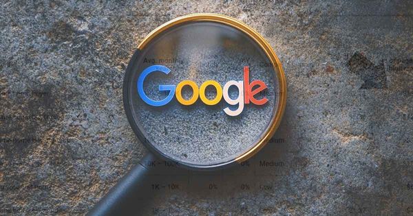 Google's logo with a magnifying glass.